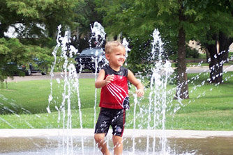Child Playing at the Splash Park
